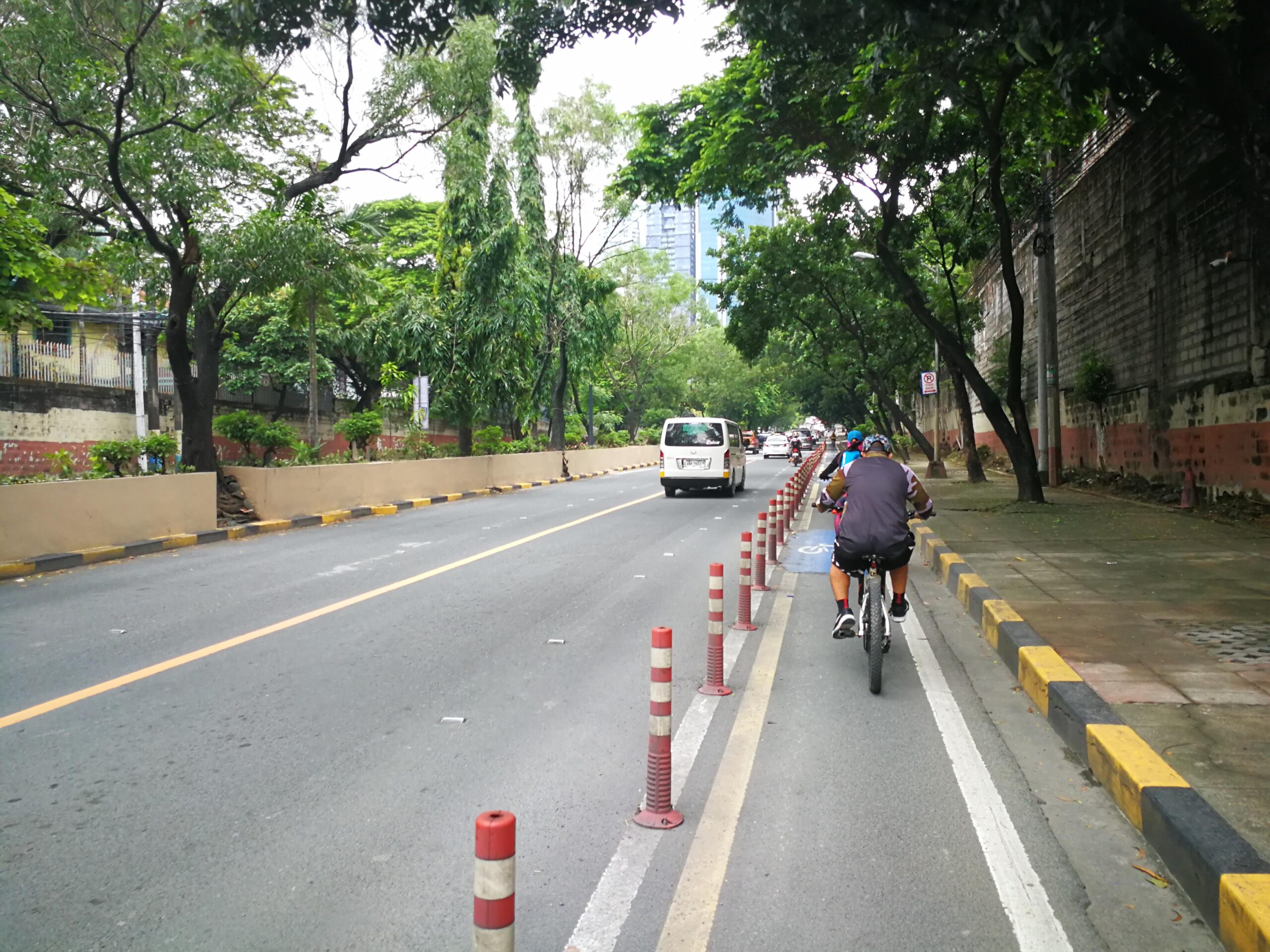 man biking along Julia Vargas bike lane