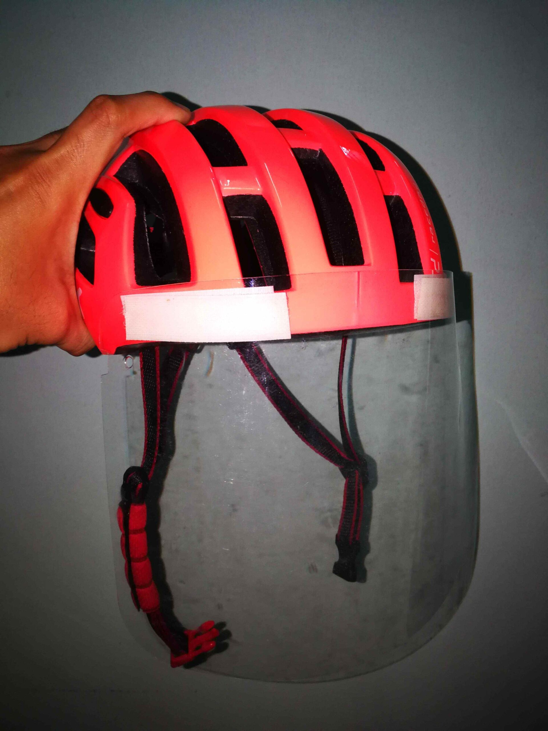 DIY face shield mounted in front of bike helmet